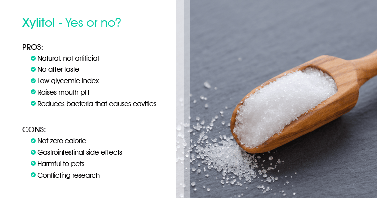 What are the benefits and cautions of xylitol? Scoop of xylitol with a table of pros and cons