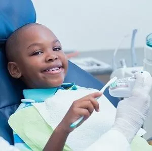 Young boy sitting in the dentist's chair