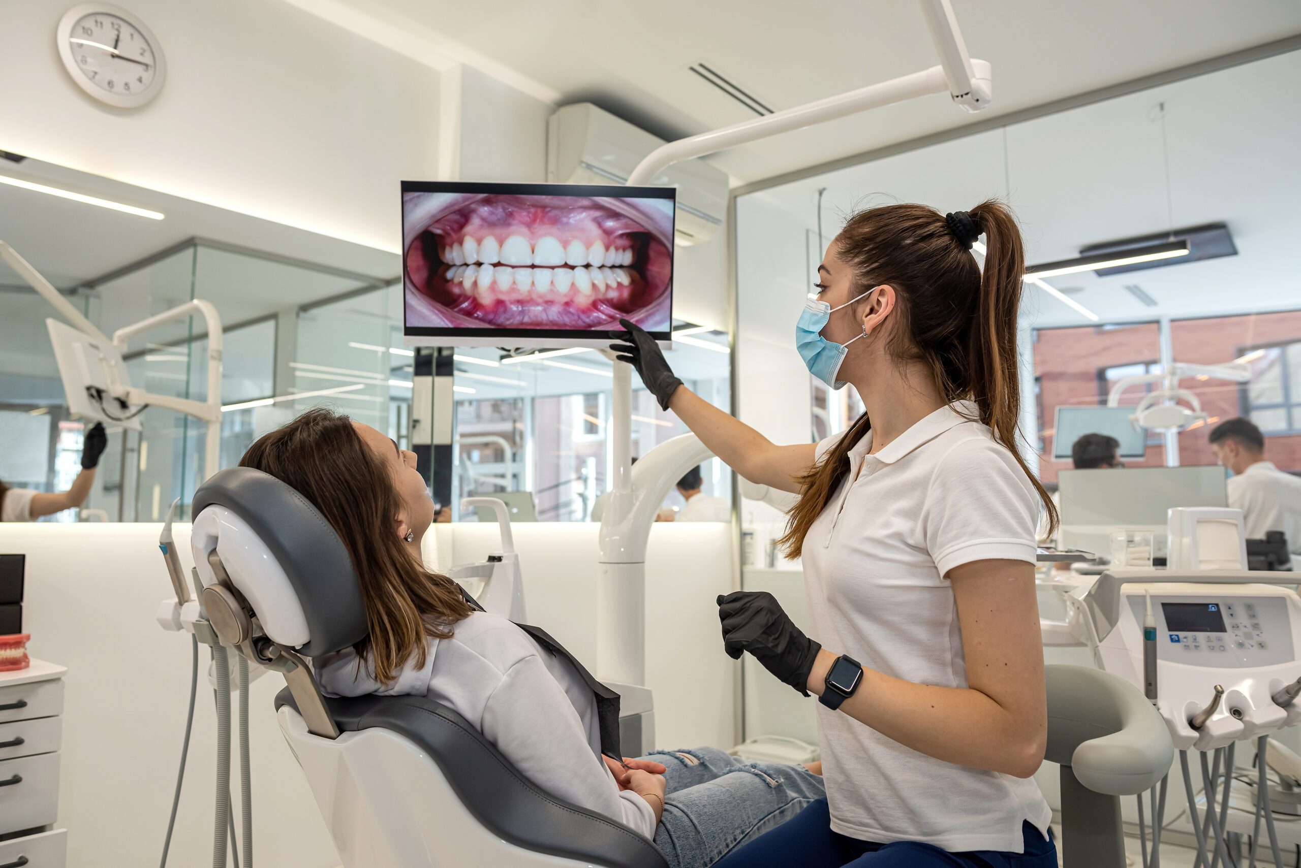 A mature man in the dentist's office waiting for his dental exam while smiling