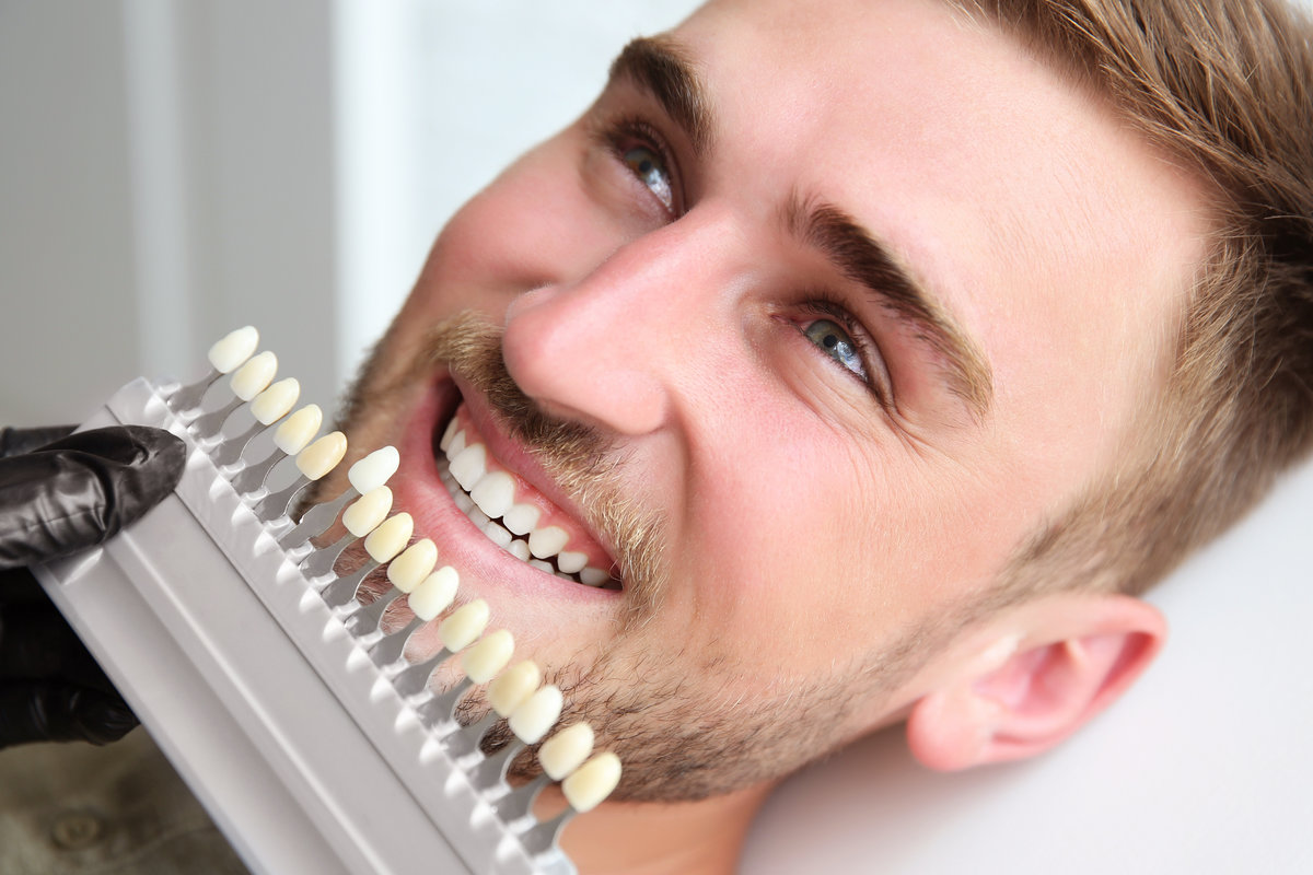 A young woman smiling with her metal-free fillings