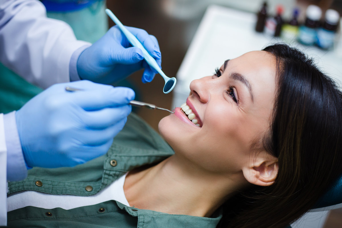 A young woman smiling with her metal-free fillings