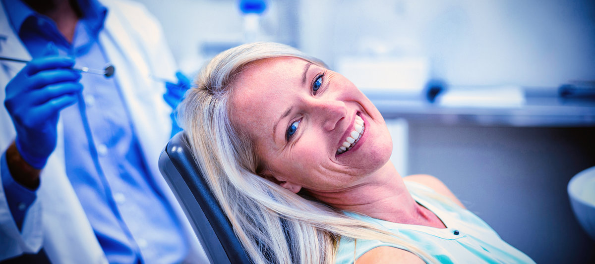 A young woman smiling with her metal-free fillings
