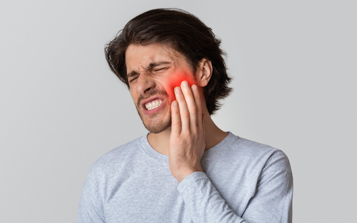 Dental care and health concept. Despaired man endure pain Dental care and health concept. Despaired man endure pain, empty space
