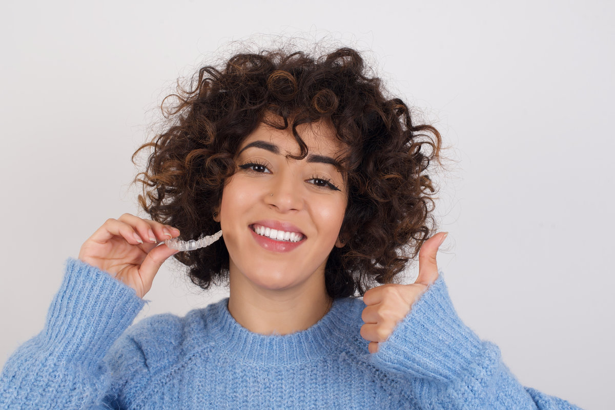 A young woman smiling with her metal-free fillings